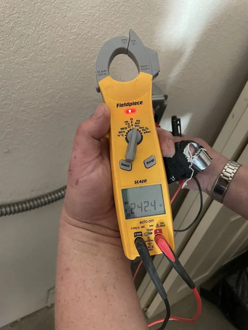 Voltage testing with clamp meter during Electrical Installation Services in New Bern